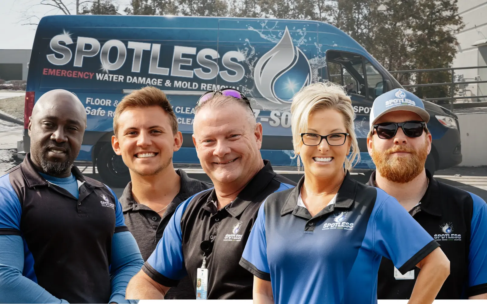The spotless mold remediation team in front of their van